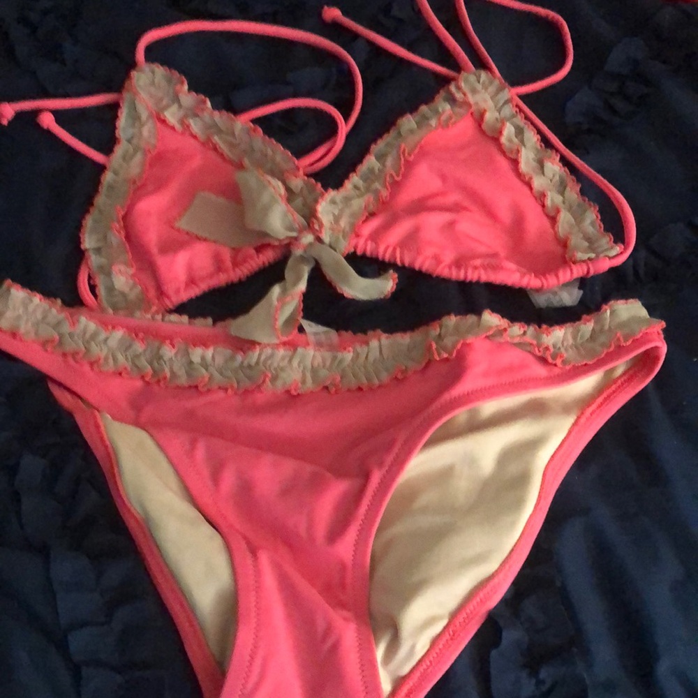 Women bikini small. Great condition. It’s coral color not pink